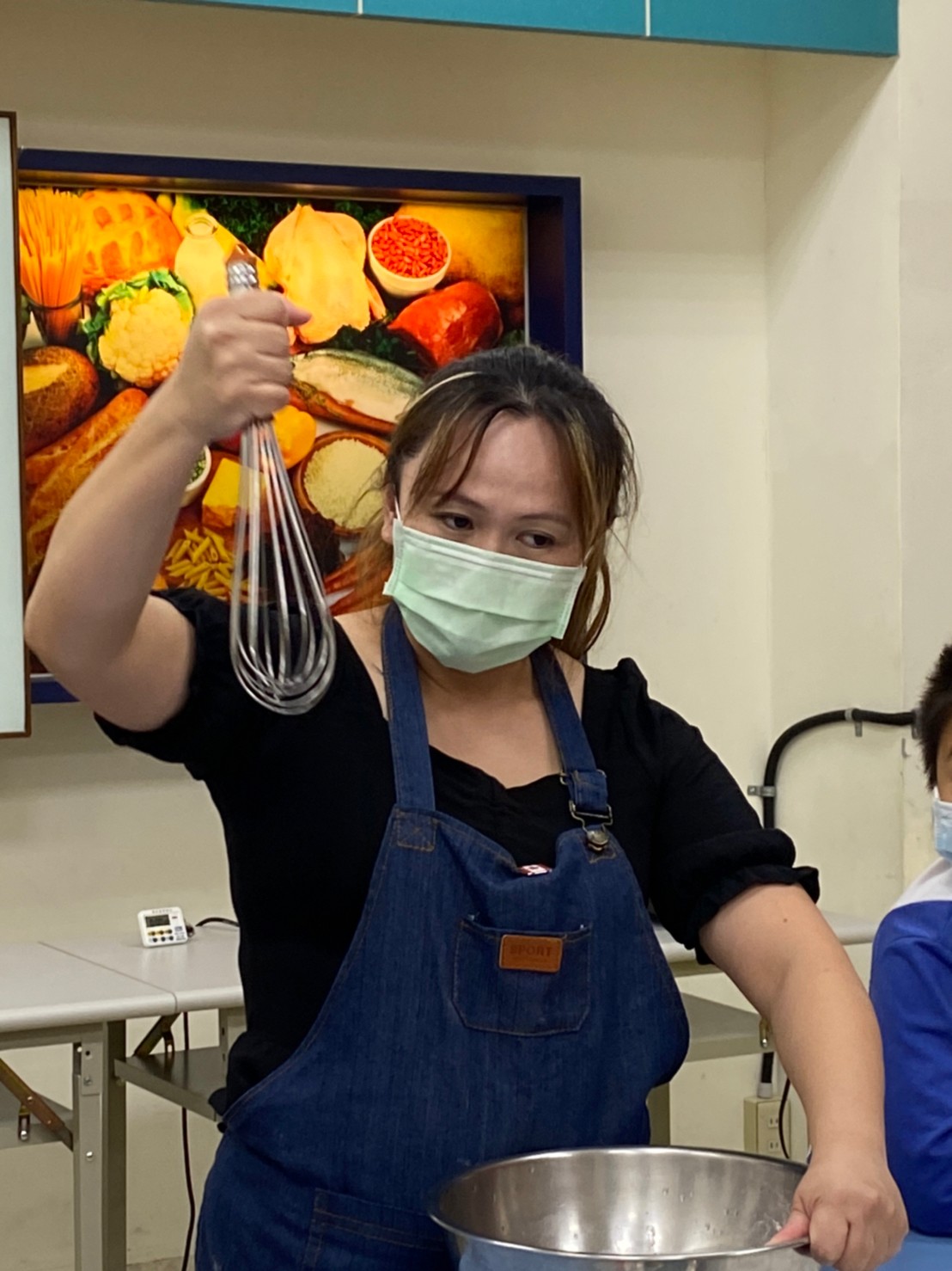 Debbie teaches students to stir the batter