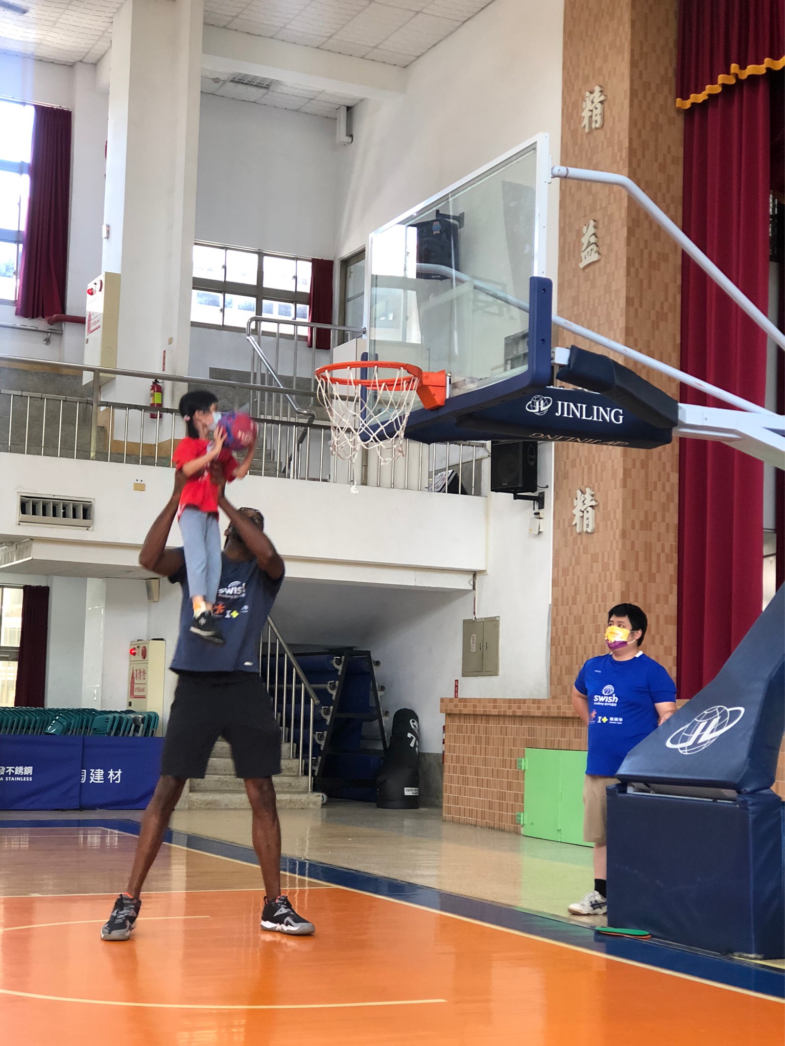 kindergarten kids having slam-dunk with Davis