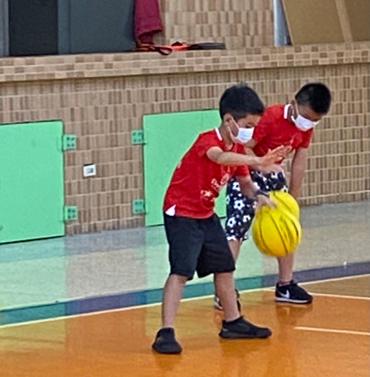 Kids are practicing how to play basketball