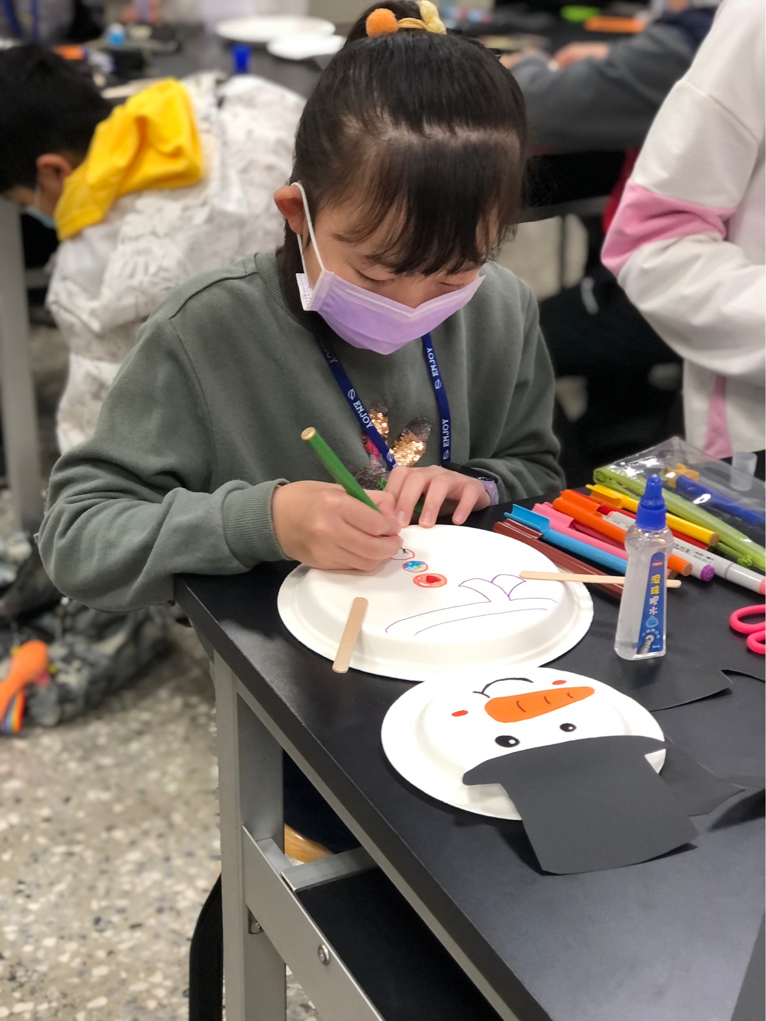 a student is making a snowman