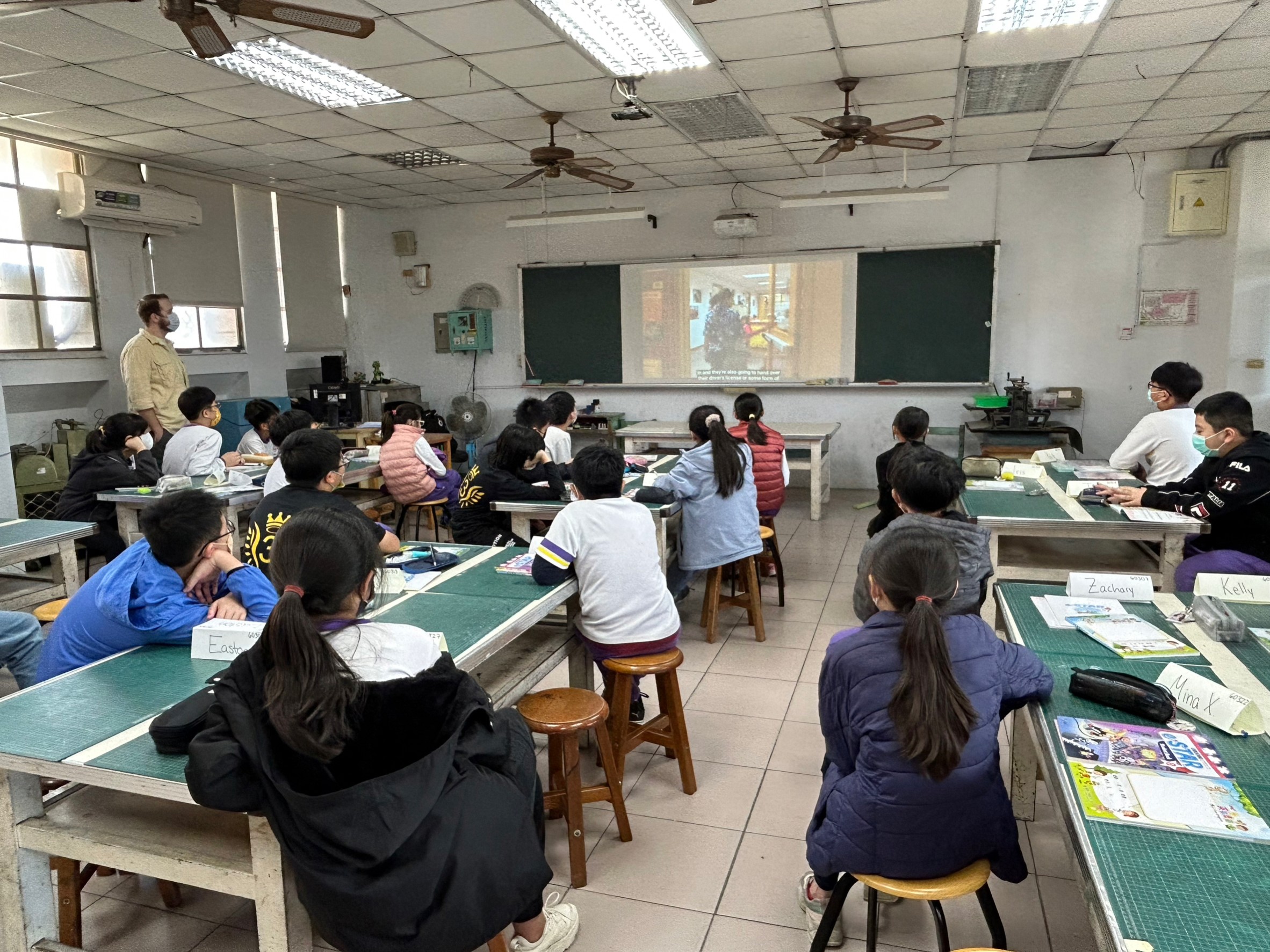 students is watching the video