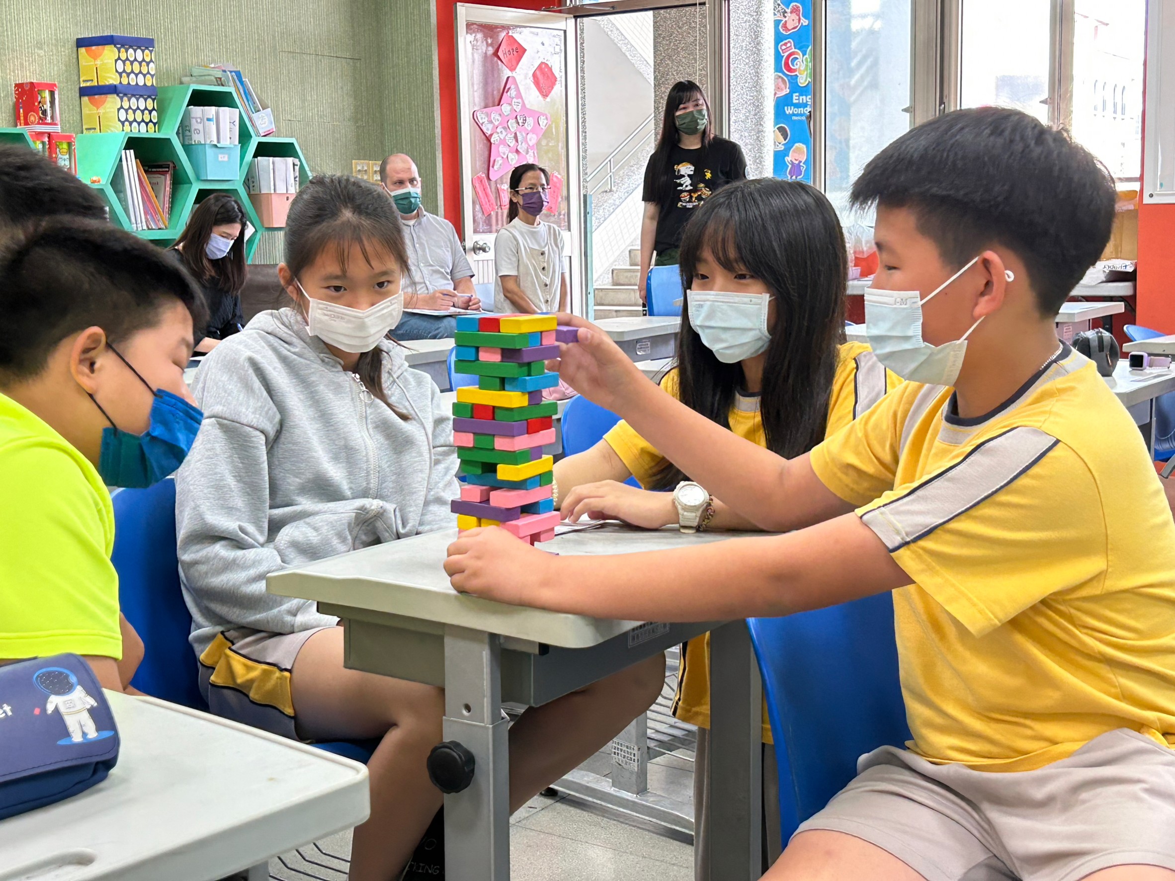 Students play Jenga to practice the pronunciation