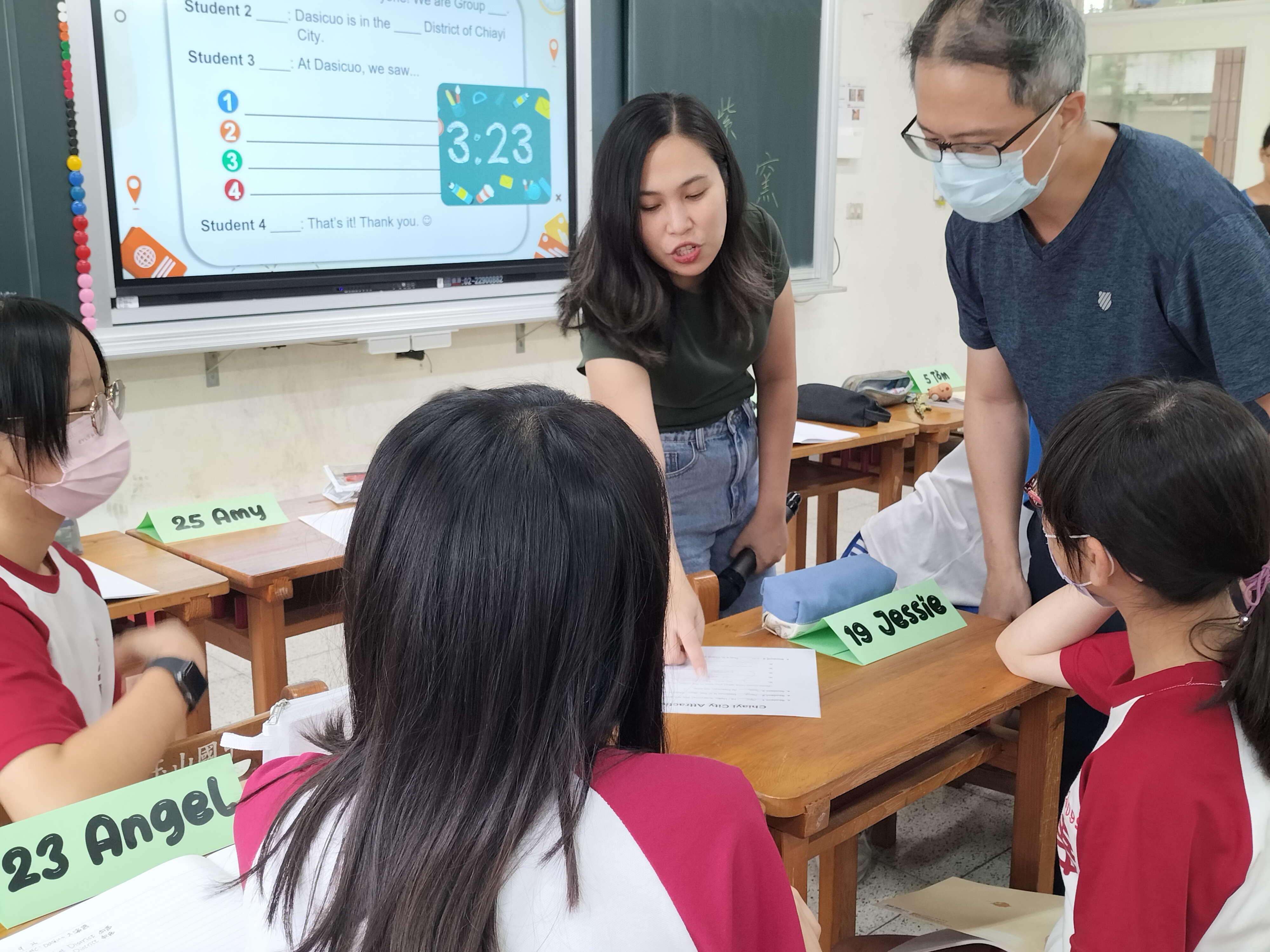 Teacher Mona and teacher James are helping out