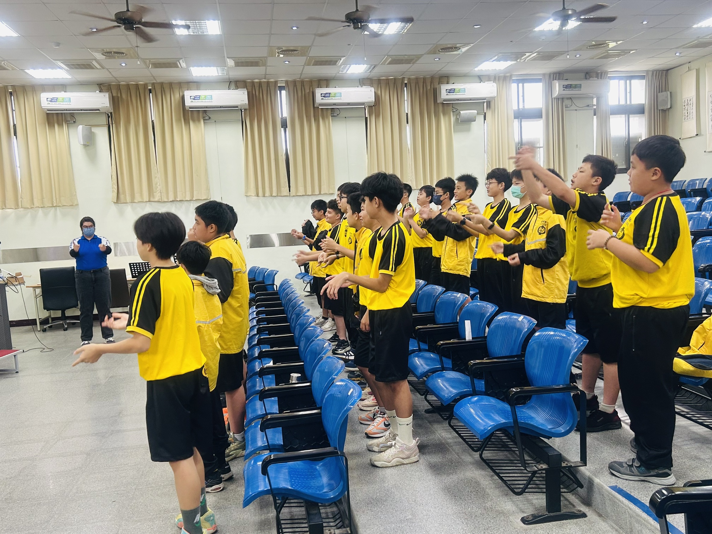 Students practice the English competition song