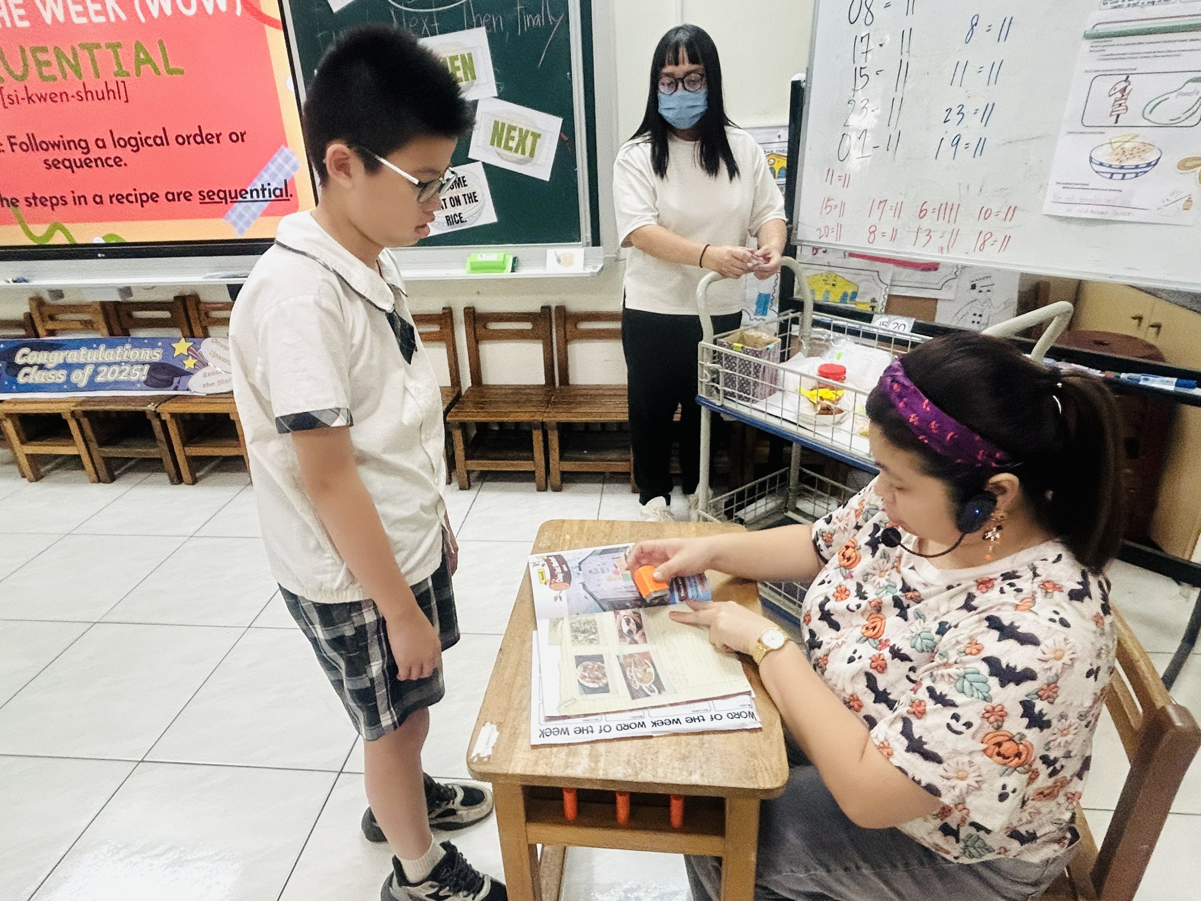 The teacher checked the students' workbooks