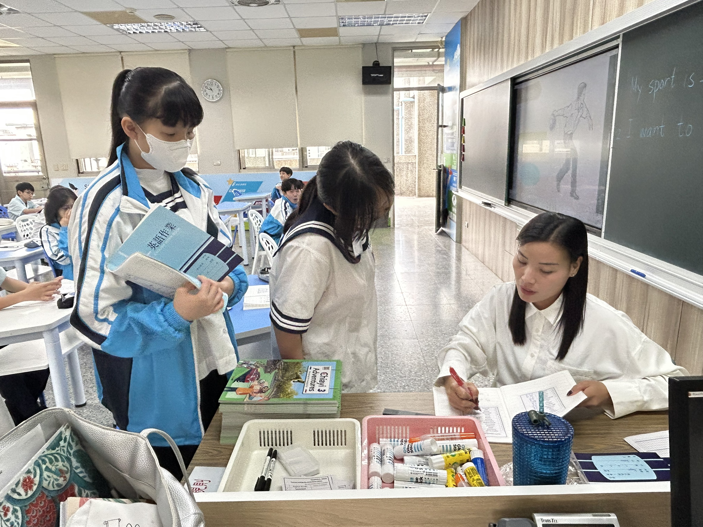 Teacher is checking students works